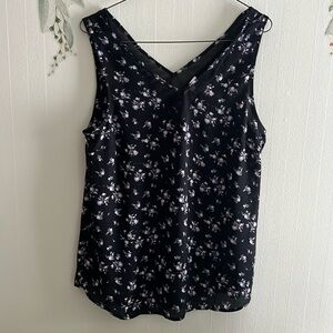 This is a silky black with purple flowers tank top.